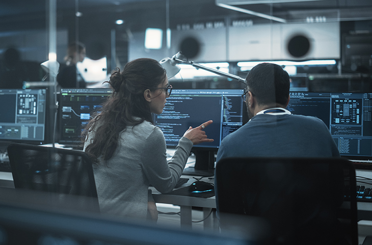 IT specialists discussing work process